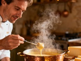 Chef européen préparant une fondue savoyarde dans une cuisine rustique, avec du fromage fondu et de la vapeur montante